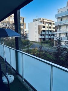 a balcony with a view of a building at Cocon family in Strasbourg