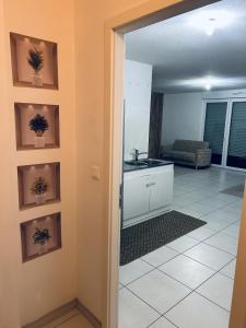 a room with a kitchen and a living room at Cocon family in Strasbourg