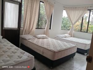 Voodi või voodid majutusasutuse Hermosa Casa Quinta En Chinauta toas