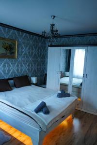 Ένα ή περισσότερα κρεβάτια σε δωμάτιο στο Pirin Elegance Apartment by Gondola Lift +34 φωτογραφίες