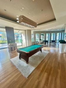 a large room with a pool table in it at Private Sea View Room in 3BR Downtown Apartment Direct Mall & Metro Access in Dubai