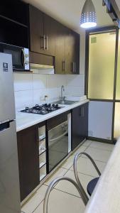 Køkken eller tekøkken på Depto Parque Parinacota a pasos de la playa