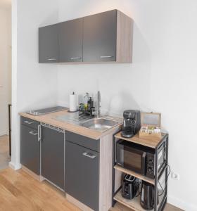 Η κουζίνα ή μικρή κουζίνα στο Premium Black Forest Suite - Apartment