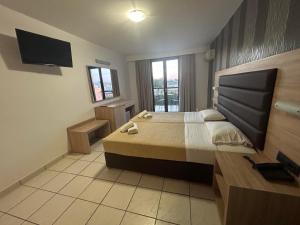 TV a/nebo společenská místnost v ubytování Alexander The Great Hotel + 28 fotografií