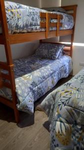a bedroom with two bunk beds and a bed at Vive Pucón in Pucón +18 photos