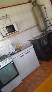 Kuchyň nebo kuchyňský kout v ubytování cabaña milita + 5 fotografií