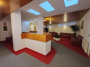 a lobby with a reception desk in a building at AL18 bilocale in Santa Caterina Valfurva