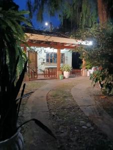 a house at night with a pathway leading to it at Jardín de Los Sueños Quinta San Felipe in Cataltzul