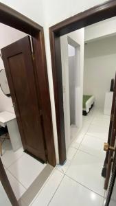 Ένα ή περισσότερα κρεβάτια σε δωμάτιο στο Suíte Standard Privado