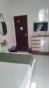 Ένα ή περισσότερα κρεβάτια σε δωμάτιο στο Suíte Standard Privado