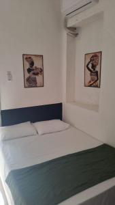 Ένα ή περισσότερα κρεβάτια σε δωμάτιο στο Suíte Standard Privado