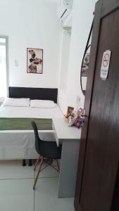 Ένα ή περισσότερα κρεβάτια σε δωμάτιο στο Suíte Standard Privado +9 φωτογραφίες