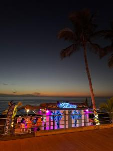 a resort with a palm tree and a roller coaster at Ático A-mar in Puerto Naos