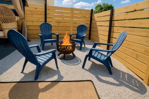 four chairs and a fire pit on a patio at Nice 3BR Apt | 3 Beds |15 Min to NYC/Manhattan! in North Bergen