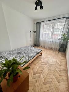 Postel nebo postele na pokoji v ubytování Na Ogrodowej między Tatrami a Gorcami