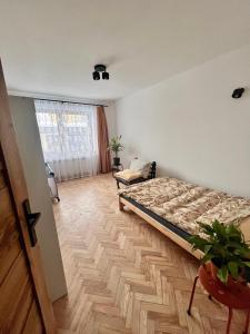 Postel nebo postele na pokoji v ubytování Na Ogrodowej między Tatrami a Gorcami