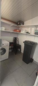 a small kitchen with a sink and a washing machine at La 62 du 11 11 in Bourbourg +10 photos