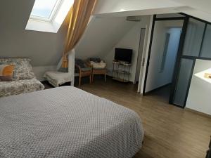 Postel nebo postele na pokoji v ubytování chambre d'hôte Léonie