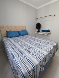 Postel nebo postele na pokoji v ubytování Apartamento aconchegante e tranquilo Suzano