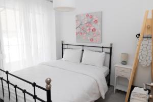 Giường trong phòng chung tại Santa Marina 8