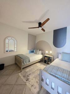 En eller flere senge i et værelse på The Nautical Nook