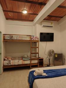 TV a/nebo společenská místnost v ubytování El Refugio Minca