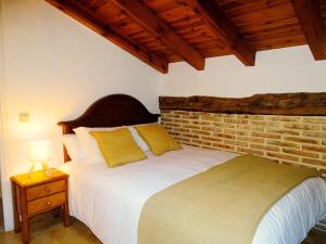 Postel nebo postele na pokoji v ubytování Casa rural El Herrero