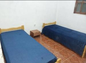 En eller flere senge i et værelse på Hostel Portal del Sol + 2 billeder