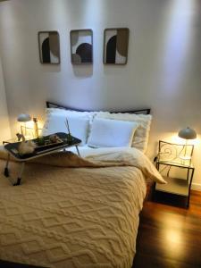 a bedroom with a large bed with two mirrors on the wall at Glamorous flat in Mertzwiller in Mertzwiller +38 photos