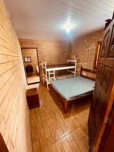 a room with a bed and a bunk bed in a house at Chácara Com Piscina e Vista das Montanhas in Atibaia +24 photos