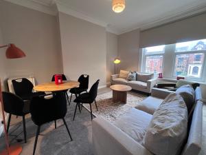 a living room with a couch and a table at The Bluebird B&B III in Central Station +27 photos