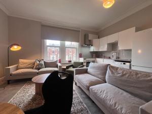 a living room with a couch and a table at The Bluebird B&B III in Central Station