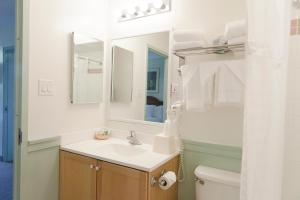 a bathroom with a sink and a toilet at Inns of Virginia Arlington in Arlington +18 photos