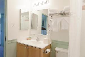 a bathroom with a sink and a toilet at Inns of Virginia Arlington in Arlington