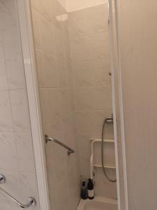 a bathroom with a shower and a toilet at Apartament Multik in Tarnów +10 photos