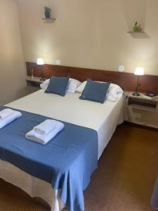 Postel nebo postele na pokoji v ubytování Hotel Palo Verde