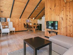 a living room with a couch and a table at Secluded Haven near Sea - By Traum Ferienwohnungen in Øster Vrøgum