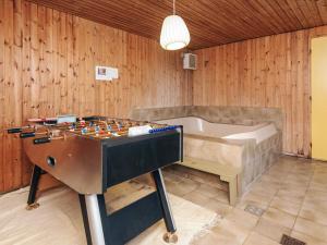 a room with a pool table and a tub at Luxury Retreat in Blavand - By Traum Ferienwohnungen in Blåvand