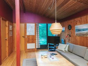 a living room with a couch and a tv at Luxury Retreat in Blavand - By Traum Ferienwohnungen in Blåvand