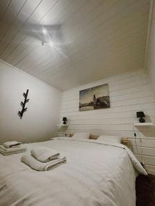 Una cama o camas en una habitación de Guesthouse Olivier