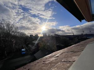 a view of the sun from the roof of a house at The Bluebird B&B III in Central Station