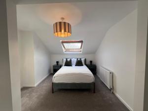 a bedroom with a bed and a ceiling at The Bluebird B&B III in Central Station