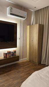 Ένα ή περισσότερα κρεβάτια σε δωμάτιο στο استديو درب الحرمين