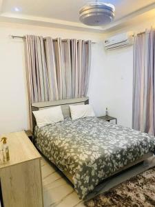 Postel nebo postele na pokoji v ubytování PG's apartments