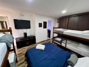 Ένα ή περισσότερα κρεβάτια σε δωμάτιο στο Pousada Paraíso do Peró +68 φωτογραφίες