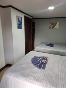 Postel nebo postele na pokoji v ubytování Casa Lapa Herradura + 6 fotografií