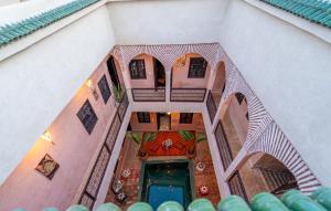 an overhead view of a building with a staircase at Riad Lalla Fatima Marrakech in Marrakesh