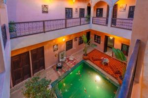 an overhead view of a pool in a building at Riad Lalla Fatima Marrakech in Marrakesh +60 photos