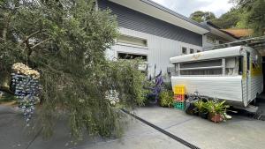 a rv parked in front of a house at Australian Retro Beach stay in Rye