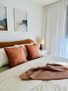 Ένα ή περισσότερα κρεβάτια σε δωμάτιο στο The Retreat at St Andrews Beach Golf Course